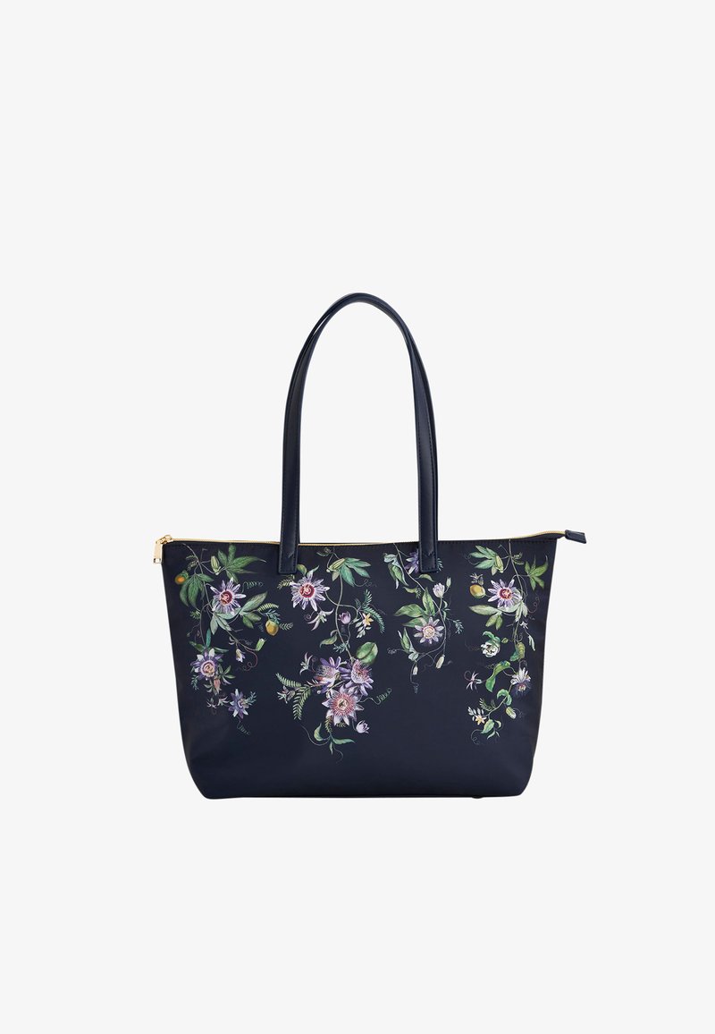 Navy tote bag with long handles and zipper, decorated with detailed pink and green floral and leaf patterns.