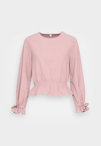 Rosa långärmad topp med rund halsringning, texturerad tyg, samlad midja och volangfållar med snörningar. Slät yta och avslappnad passform.