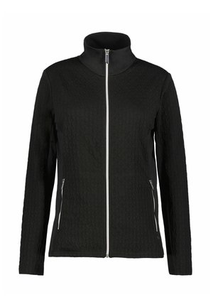 Veste zippée noire avec un motif texturé sur le devant, des côtés noirs lisses, un col haut et des détails en métal argenté sur la fermeture éclair.