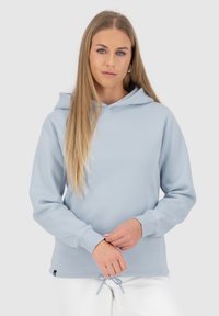 Felpa con cappuccio azzurro chiaro realizzata in tessuto morbido, dotata di un cordoncino all'orlo e polsini a coste per una vestibilità comoda.