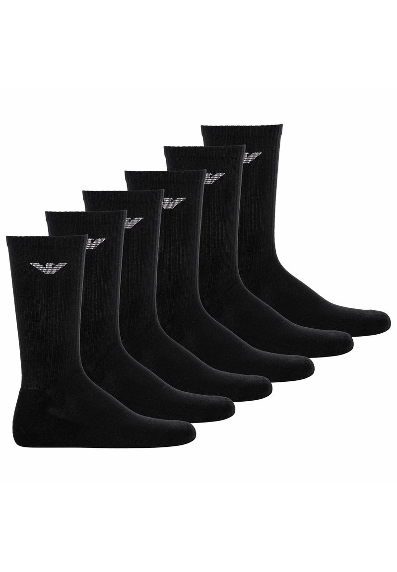 Calcetines de algodón negros en un paquete de seis, con textura acanalada y un pequeño logo plateado en la parte superior. Diseño clásico y largo hasta la mitad de la pantorrilla.