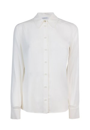Camicia bianca a maniche lunghe realizzata in tessuto liscio, con colletto a punta, chiusura frontale con bottoni e una vestibilità rilassata.