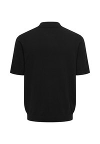Polo noir à manches courtes vu de dos avec un ourlet côtelé et un col classique sur fond blanc.