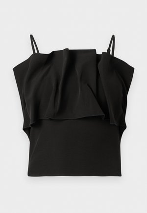 Haut noir sans manches avec fines bretelles et un grand volant sur la poitrine, présenté sur un fond blanc.
