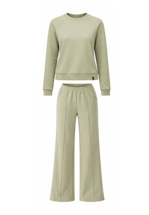 Hellgrünes Sweatshirt mit langen Ärmeln und Rippbündchen sowie locker sitzende Hosen mit elastischem Bund und vorderen Nähten.