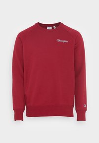 Felpa rossa realizzata in tessuto misto cotone, con scollo rotondo e polsini a costine, dotata di un piccolo logo sul petto e sulla manica.