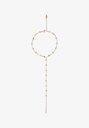 Bransoletka z łańcuszkiem w złotym odcieniu z małymi zawieszkami w kształcie gwiazdek oraz regulowanym zapięciem, z wiszącym łańcuszkiem z gwiazdkami.