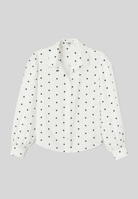 Chemise blanche à manches longues et col étalé, ornée d'un motif de pois noirs et de poignets froncés.
