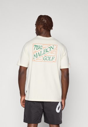 Cream cotton t-shirt featuring a colorful "M.G.C. MALBON GOLF" graphic on the back, short sleeves, and a relaxed fit.