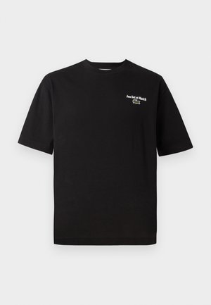 T-shirt in cotone nero a maniche corte, collo rotondo, con ricamo bianco "Jeu Set et Match" e un accento del logo coccodrillo verde.