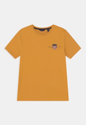 ARCHIVE SHIELD UNISEX - T-shirt print - ivy gold