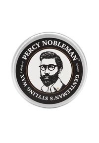 Ronde metalen blikken met een zilveren deksel. Zwart cirkelvormig etiket met een geïllustreerde man met een bril en een baard, tekst in wit en gouden accenten.