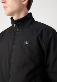 Calvin Klein Jeans HARRINGTON - Jas - black