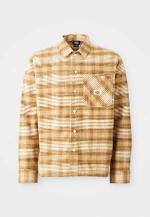 Brown and cream plaid long-sleeve shirt made of textured fabric with a chest pocket and button closure, featuring a label on the pocket.