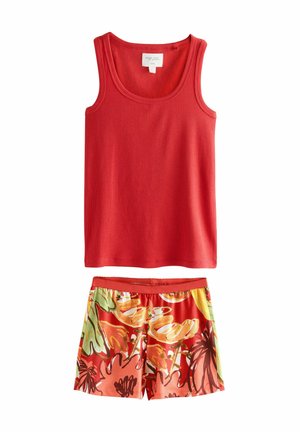 Rood geribbeld tanktop met brede banden bovenop bloemenprint shorts met oranje, gele en groene patronen. Zacht materiaal, casual pasvorm.