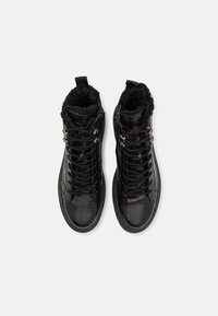 Black lace-up ankle boots with a textured crocodile pattern, plush black lining, and silver-tone hardware accents.
