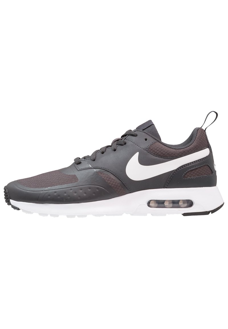 Nike Air Max shoes, featuring a black upper with textured accents, white sole, prominent Swoosh logo, and visible air cushioning unit.