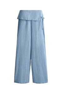 Light blue wide-leg pants with vertical stripes, fold-over waistband, and a small side bow detail.