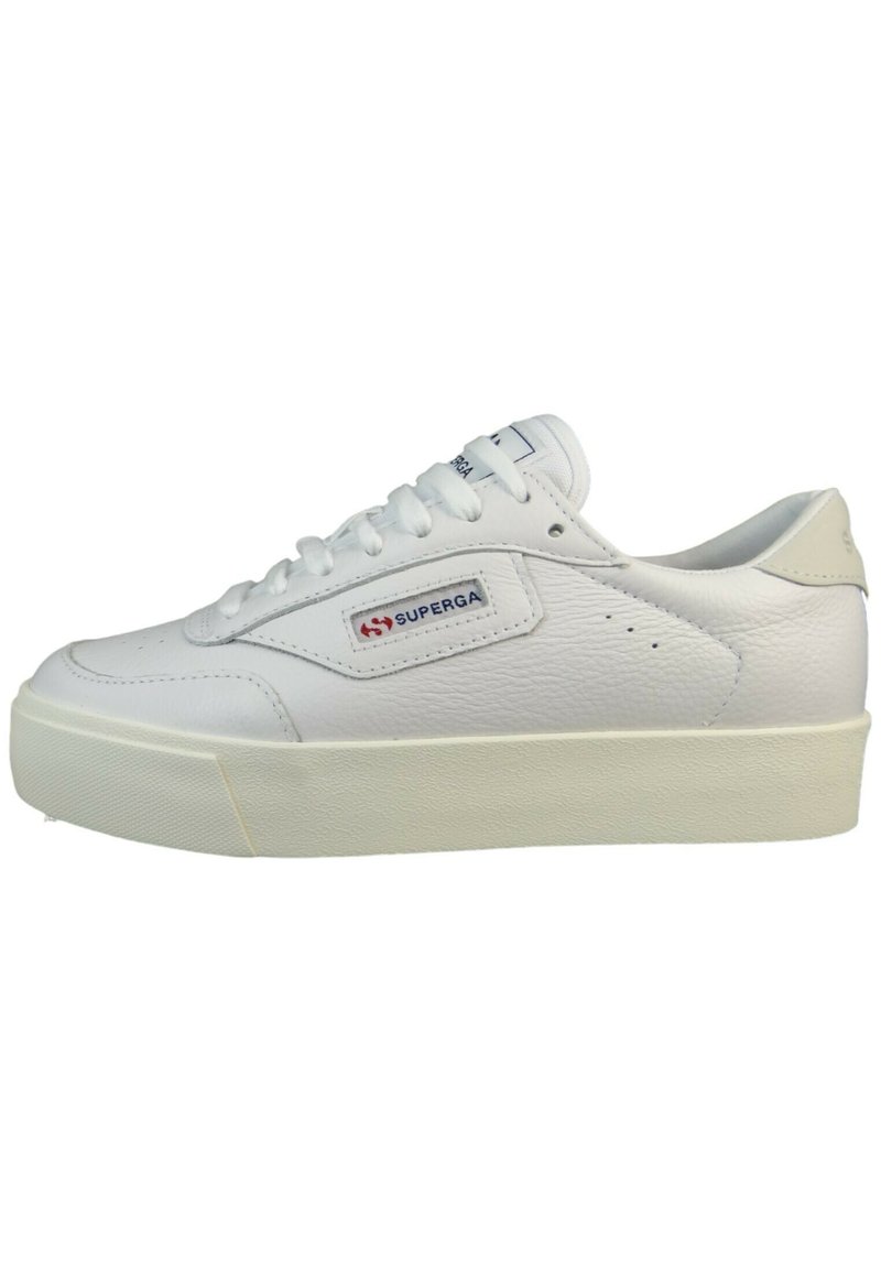 White leather sneaker with a textured surface, round toe, flat white laces, and a stacked rubber sole. Features a red and blue logo patch.