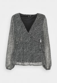 Blusa nera trasparente con maniche lunghe, motivo a pois bianchi irregolari, scollatura a V con chiusura avvolgente e polsini e vita arricciati.