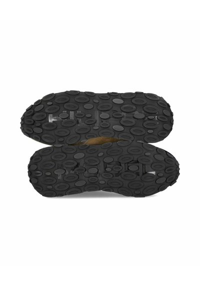 Zwarte schoenzolen met een textuurpatroon van verhoogde ovalen, ontworpen voor grip en tractie, gemaakt van een stevig, duurzaam materiaal.