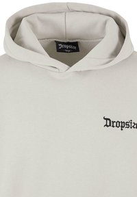 Light gray hoodie with a large front pocket, drawstring hood, and black embroidered "Dropsize" logo on the left chest. Soft cotton blend material.