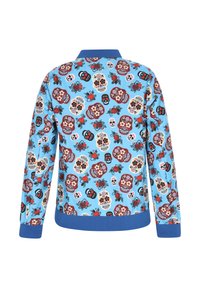 Pulover albastru cu un model vibrant de crani și flori, cu manșete și talie cu nervuri albastre. Material moale, proiectat cu mâneci lungi.