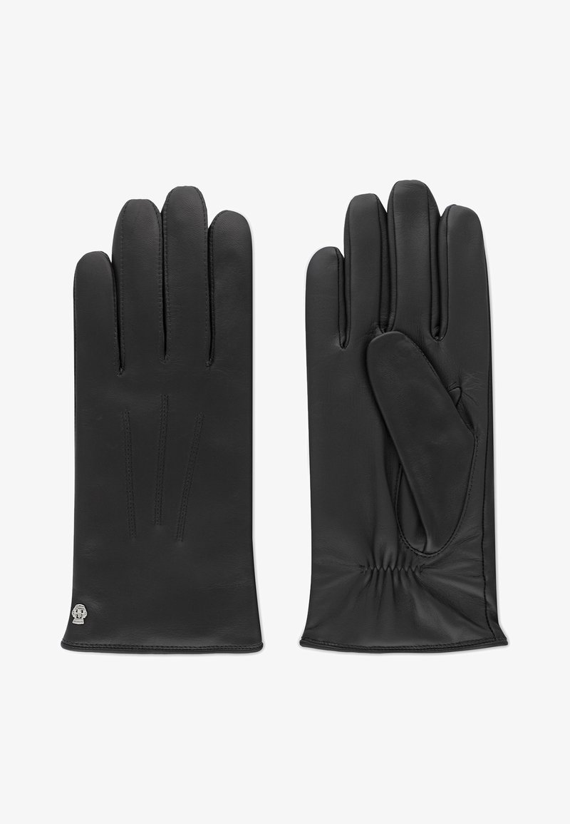 Gants en cuir noir avec une texture lisse, trois coutures sur le dos et poignet élastiqué pour un ajustement serré. Petit logo près du poignet.