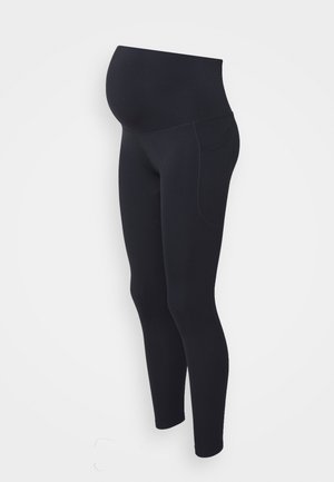 Fekete kismama leggings sima textúrával, magas derékkal a támogatásért és oldalsó zsebekkel. Testhezálló dizájn, amely fokozza a kényelmet és a rugalmasságot.