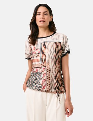 Short-sleeve, patterned blouse featuring abstract designs in shades of pink, brown, and black; includes a pocket and drawstring detail at the hem.