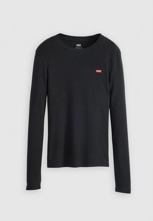 T-shirt noir à manches longues en coton, avec un col rond et un petit logo rouge de Levi's sur la partie gauche de la poitrine. Tissu texturé.