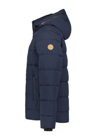 Navy blue puffer jacket with a hood, ribbed texture, side zipper pocket, and round logo patch on the left arm. Features a modern design.