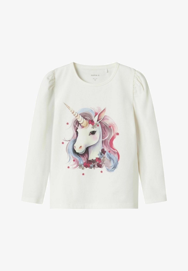 White long-sleeve top featuring a unicorn graphic with pastel pink and blue mane, surrounded by floral accents. Soft cotton material.