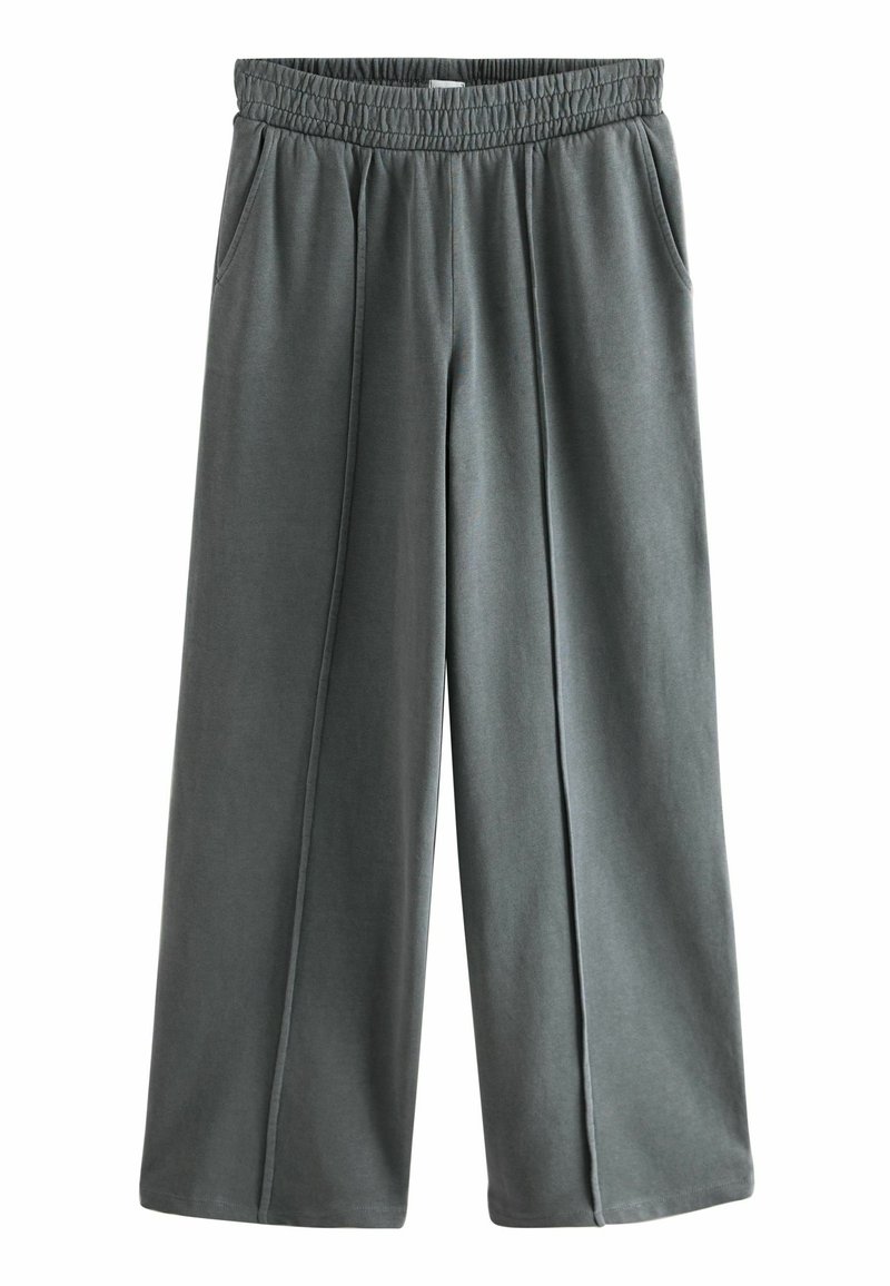 Pantaloni larghi grigi con vita elastica e tasche frontali, caratterizzati da cuciture decorative lungo la parte anteriore di ciascun gamba.