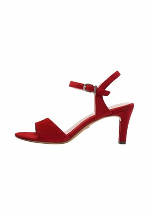Red suede heeled sandal with an open toe, ankle strap, and a silver buckle. Features a pointed toe and a stiletto heel.