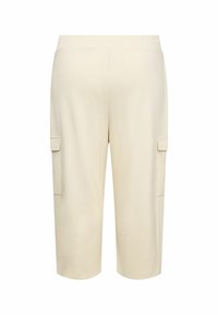 Beige cargo pants with an elastic waistband, cropped length, and two side cargo pockets. Smooth fabric texture, straight leg design.