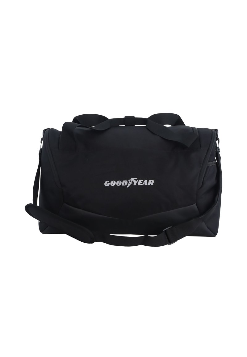 Black duffel bag made of durable fabric, featuring two handles and an adjustable shoulder strap. Displays "GOODYEAR" logo in white.