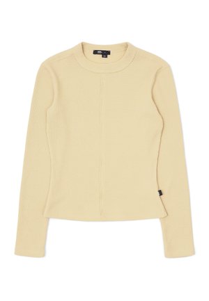 Long-sleeve ribbed top in light yellow. Features a round neckline, close-fitting shape, and subtle side seam detailing. Cotton blend material.