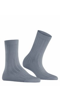 Graue Socken mit gerippter Textur, versehen mit vertikalen Streifen und einer verstärkten Spitze. Hergestellt aus einem weichen Material, geeignet für die Freizeit.