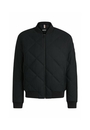 Black quilted bomber jacket with ribbed cuffs and hem, featuring a front zipper and a tag on the neck with the brand logo.