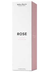 Raumdifusor mit einer hohen, rechteckigen weißen Box mit einem rosa Akzent. Schwarze Typografie zeigt "ROSE" und Produktdetails. Größe: 150ml.