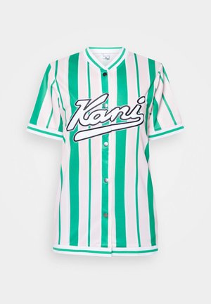 Zöld és fehér vertikális csíkos, rövid ujjú mez, kerek nyakkivágással, patent gombokkal és fekete hímzett "Kani" logóval.