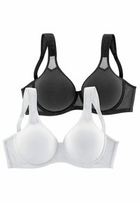 Schwarz-weiße BHs mit glatten, geformten Cups, verstellbaren Trägern und nahtlosem Design. Weicher Stoff mit kontrastierenden Nähten.