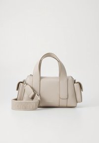 Beige leather handbag with dual handles, removable shoulder strap, rectangular shape, and subtle logo detail on the front.