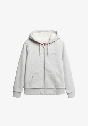 Sudadera gris con cremallera y suave forro de felpa blanca. Cuenta con dos bolsillos delanteros, puños acanalados y un logo bordado encima de la cremallera.