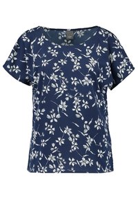 Tyrkysová blůza s krátkým rukávem s květinovým vzorem v bílé barvě. Má kulatý výstřih a volný střih, vyrobena z lehkého materiálu.