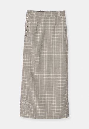Long, grid-patterned skirt in black and white. Features a straight cut, high waist, and decorative side buttons. Made of woven fabric.