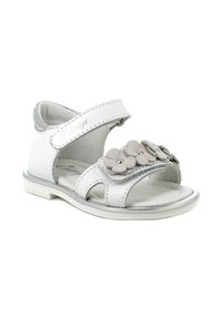 Sandalino bianco con cinturino in velcro, design aperto sulla punta, applicazione decorativa di fiore grigio e suola in gomma testurizzata.