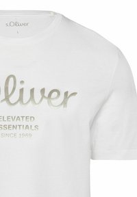 White cotton T-shirt with short sleeves featuring a metallic silver logo and text saying "s.Oliver Elevated Essentials Since 1969."
