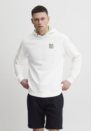 White hoodie with a light green interior, featuring a patch of palm trees. Soft texture, ribbed cuffs, and a kangaroo pocket design.